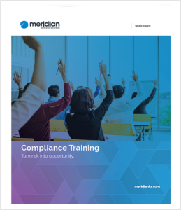 cover image for the compliance training ebook with a group in a class all looking forward and raising their hand with a question