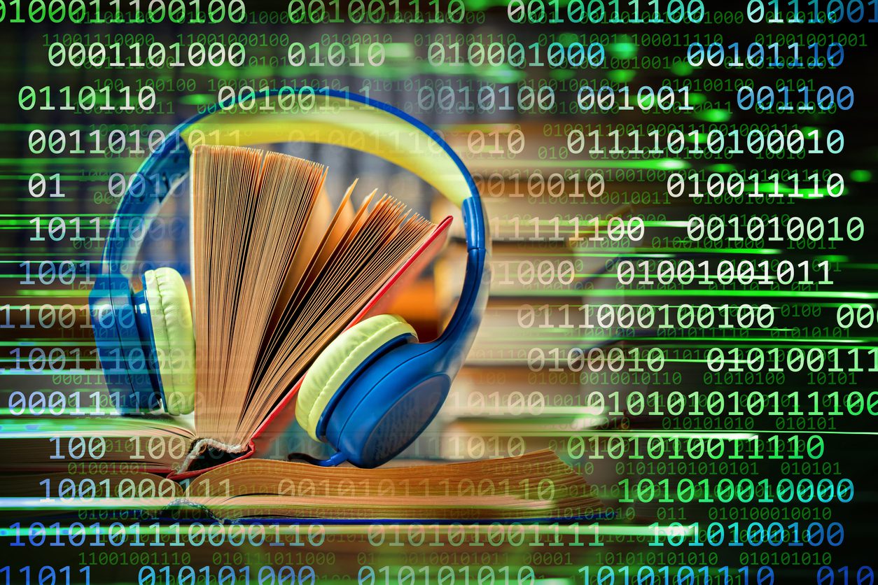Close-up of headphones with stacks of books on a binary code background. Can illustrate the concept of electronic audio books.